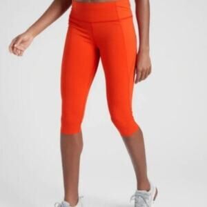 Athleta Velocity Stash Pocket Orange Capris Leggings